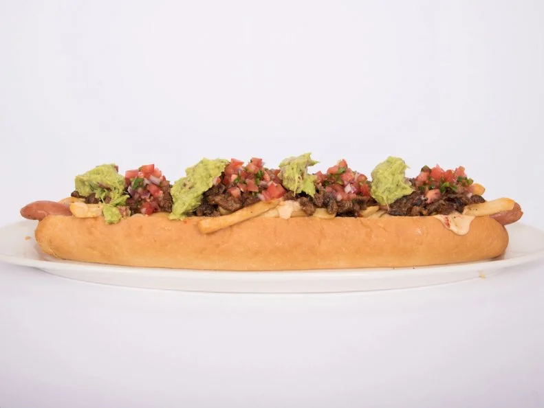 You could eat: Game Seven Grill is a wing-lover's destination, with spicy wings made with ghost peppers. They're as intense as they sound, and a great way to break a sweat in the desert heat.
You should eat: No strangers to good Mexican food, Arizonans sneak Southwestern accents into plenty of dishes, including the new Asada Dog. A locally made 18-inch hot dog is tucked into a telera roll - similar to a French roll - with fries, queso blanco, salsa, guacamole and carne asada for double meatiness. 