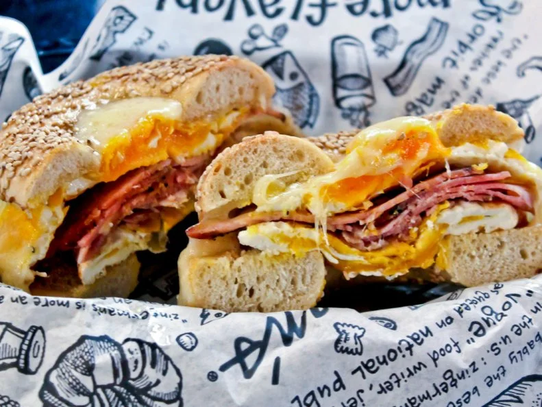 This Ann Arbor institution is a bakery, a creamery, a coffeehouse, a candy manufactory and the source of a popular national food catalogue. But above all else, Zingermanâ  s is and always will be known as a destination for excellent Jewish deli fare. Just ask the Ann Arbor locals who have enjoed fresh sesame bagels since the early 1980s. Founded by longtime restaurant professionals Paul Saginaw and Ari Weinzweig, Zingermanâ  s has grown into a gourmet food empire with several divisions across the state of Michigan. Still, the deli holds claim over its original site at the intersection of Detroit and Kingsley. According to Weinzweig, â  The parking is still bad, the location still hard to find, but the neighborhood is now considered a great place to live.â   And, as loyal customers will tell you, the Extra Special is still a great sandwich to order. Listen to them. Itâ  s cold smoked salmon and smoked whitefish salad with scallion cream cheese, tomato and red onion on a toasted sesame bagel.https://www.zingermansdeli.com/menus/breakfast/