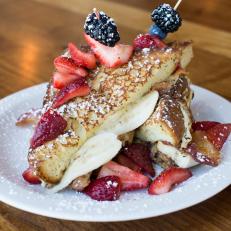 Located just a poker chip’s throw from the Burlesque Hall of Fame, this Arts District gem pays homage to Sin City’s most-notorious performer with one zany breakfast creation. The Fat Elvis offers up all of The King’s favorite sandwich ingredients — bacon, bananas and peanut butter — with the addition of Nutella and fresh strawberries. The bread? Two slabs of griddled French toast. For anyone skeptical of this incredible flavor bomb, try the equally satisfying B.L.T.A.E. It has all of the standard B.L.T. components, plus avocado, a sunny-side-up egg, basil pesto and mayo on grilled brioche.
http://mtocafe.com/downtown-mto-menu/#/