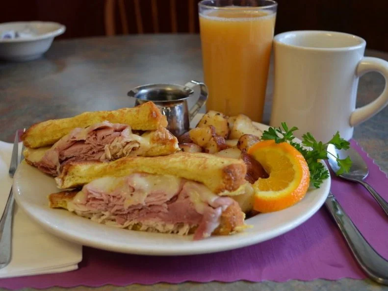 Itâ  s no surprise that New England â   a region prized for its maple syrup â   has a serious obsession with Monte Cristos, the classic ham-and-cheese sandwich wrangled together by two crispy slabs of French toast. The award for â  bestâ   could go to this little roadside diner at the foot of New Hampshireâ  s Mount Washington. For $10, diners can feast on the Mighty Monte Cristo, which includes Swiss cheese plus thin-sliced ham and oven-roasted turkey breast, for the best of both worlds. The hearty combo is grilled on Texas-style French toast and served with home fries and a side of real maple syrup, because New Hampshirites wouldnâ  t have it any other way. Itâ  s great fortification before an excursion through Mount Washington Valley.http://www.bannersnh.com/index.php/breakfast-menu/fabulous-melts.html