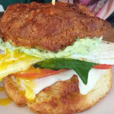 Donâ  t sleep too late if you plan on making a sandwich run to Biscuit and Bean. This bustling breakfast hub has been known to sell out of biscuit flavors by the early afternoon. Classic buttermilk, cheddar-chive and a rotating special biscuit are on offer every morning, and any of the three can be used in one of the cafeâ  s five breakfast-sandwich options. The Classic is perfect in its simplicity. The flagship white cheddar from Seattleâ  s famed Beecherâ  s makes an appearance on this incredible bacon, egg and cheese sandwich, which the chefs finish with a swipe of sweet tomato jam. The Signature goes above and beyond the call of breakfast sandwich duty; itâ  s prosciutto, smoked Gouda and a buttery fried egg under a canopy of pickled pepper aioli from Mama Lilâ  s Peppers. The chefs throw some spinach on too, probably just to mitigate some of the guilt. https://www.biscuitandbean.biz