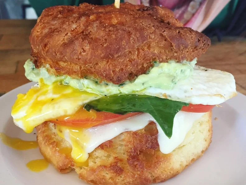 Donâ  t sleep too late if you plan on making a sandwich run to Biscuit and Bean. This bustling breakfast hub has been known to sell out of biscuit flavors by the early afternoon. Classic buttermilk, cheddar-chive and a rotating special biscuit are on offer every morning, and any of the three can be used in one of the cafeâ  s five breakfast-sandwich options. The Classic is perfect in its simplicity. The flagship white cheddar from Seattleâ  s famed Beecherâ  s makes an appearance on this incredible bacon, egg and cheese sandwich, which the chefs finish with a swipe of sweet tomato jam. The Signature goes above and beyond the call of breakfast sandwich duty; itâ  s prosciutto, smoked Gouda and a buttery fried egg under a canopy of pickled pepper aioli from Mama Lilâ  s Peppers. The chefs throw some spinach on too, probably just to mitigate some of the guilt. https://www.biscuitandbean.biz