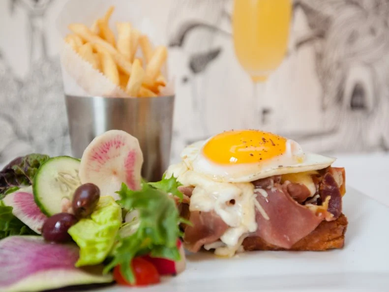 Come for historic Lewisburg relaxed-country atmosphere and stay for the Croque Madames. Set inside of Maison Marcel, a 19th-century manor house that’s now a bed and breakfast, this bistro specializes in classic French cuisine with a modern twist. The Croque Madame begins with a base of tangy sourdough and subs the usual ham for Italian prosciutto. From there, the more traditional croque ingredients follow: Gruyere, mornay sauce, a fried egg and salad or frites on the side. You can walk it off on the garden terrace afterward.
http://thefrenchgoat.com/menu/