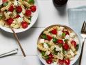 https://food.fnr.sndimg.com/content/dam/images/food/fullset/2018/3/30/0/LS-Library_Tomato-and-Fresh-Mozzarella-Pasta-Salad_s4x3.jpg.rend.hgtvcom.126.95.suffix/1522443803190.jpeg