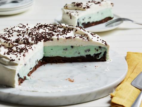 Mint Chocolate Chip Ice Cream Cake with Brownie Crust and Vanilla Whipped Cream Frosting