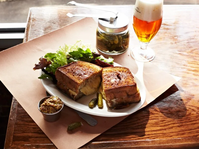 New Haven native Jason Sobocinski put his masters degree in gastronomy to good use when he founded Caseus, an artisan cheese shop and bistro that dishes up some of the state’s cheesiest creations. To wit, the grilled cheese sandwich features a whopping half pound of cheeses, including flavor powerhouses like extra-sharp cheddar, Schnebelhorn, Beemster Gouda, and prime melters like Comte, Gruyere, Provolone and Raclette. The cheese is piled onto slices of thick-cut rye, grilled in brown butter and served with grainy mustard and cornichons to cut the richness. Diners can double down on the decadence with standard add-ons like house-made bacon lardons, or custom requests; one daring diner’s addition — a slice of apple pie and guanciale — is the stuff of local legend.