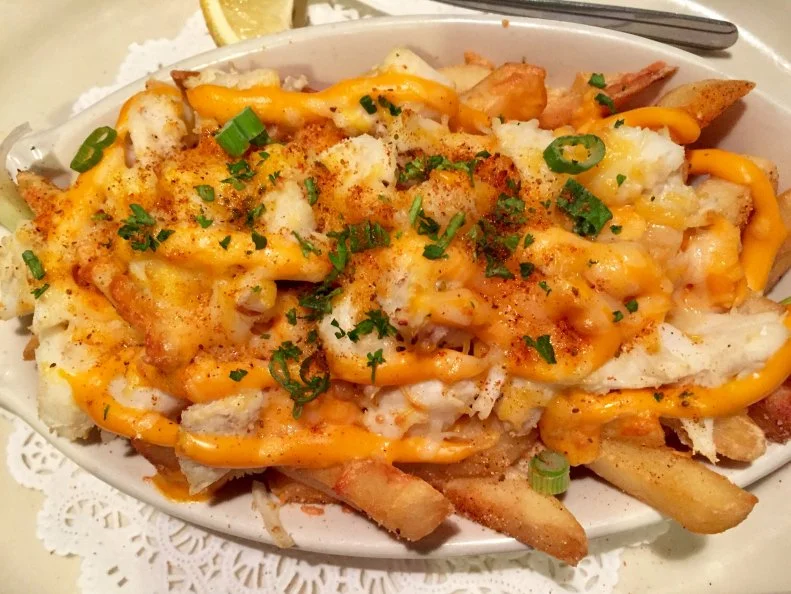 Maryland is synonymous with crab, and locals believe that Chesapeake Bay blue crabs are the best in the world. Casual Baltimore seafood spot Angie’s Seafood spins the prized crustacean into multiple crowd-pleasing preparations, like Crab Balls, Crabby Mac ‘n’ Cheese and the fan-favorite Crabby Fries. Fresh-cut French fries are piled with sweet blue crab meat and a secret blend of shredded cheeses and seasoning, then baked until gooey. It’s the perfect opener to a crab-and-carb-fueled feast. 