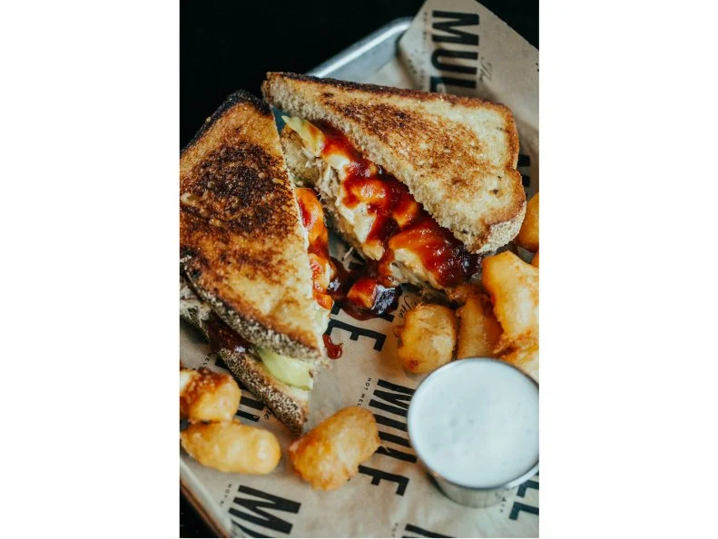 Situated in Oklahoma City’s Plaza District, The Mule stands out from the other local spots for its dedication to gourmet grilled cheese sandwiches. Combine the cheese with Oklahoma ‘cue by opting for the Macaroni Pony. Grilled slices of jalapeno cornbread come crammed with a creamy, meaty filling made from mac and cheese, dill pickles and a heap of slow-roasted pulled pork dressed with diced chipotle peppers and local Head Country barbecue sauce. The barbecue rub recipe is top-secret, but the kitchen divulges that the mac and cheese gets its distinct flavor from the combination of smoked Gouda, sharp cheddar and Gruyere. Double down on the cheesiness factor with a side of fried, beer-battered cheddar cheese curds from Watonga (they’re rumored to rival Wisconsin’s curds). The local craft beers, which include options from microbrewery Anthem Brewing, make for a nice pairing.