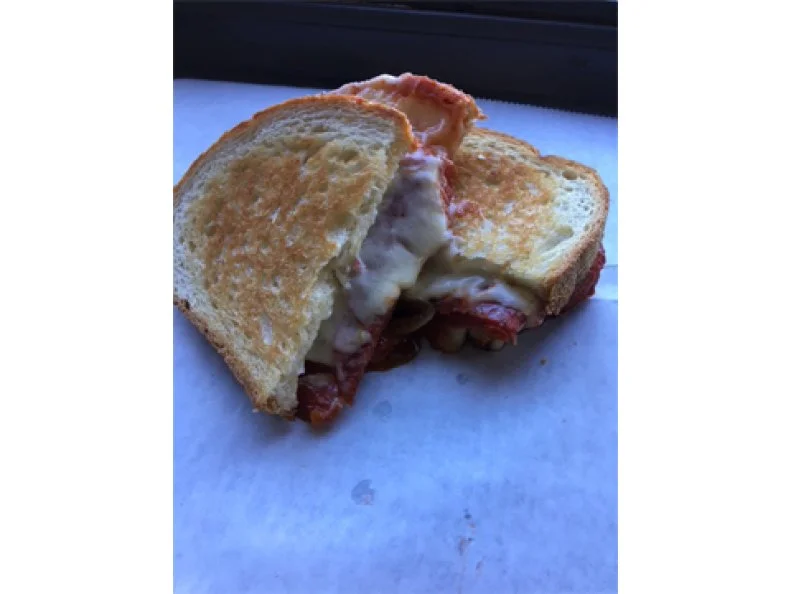 The original pepperoni roll was created at a Fairmont bakery in the 1920s and quickly became a lunch favorite for West Virginia coal miners since the bread-wrapped pepperoni required no refrigeration. Since then, it has evolved into a statewide snack obsession, so you’ll find imitations and gourmet spins on menus statewide. At Cheese Louise, Chef-Owner Lawton Parnell turns the roll’s main components into gourmet grilled cheese, his shop’s specialty. Slices of bread are slicked with butter and mayo, then layered with pepperoni, pepper Jack and Muenster cheeses. Once on the grill, the sandwich is stuffed with Oliverio’s Italian-style peppers (a local delicacy of sweet bell peppers in marinara sauce), then smashed into a gooey masterpiece.