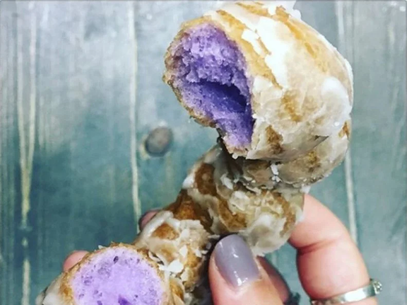 You know that mashed purple starch thatâ  s part of every Hawaiian luau? It becomes dessert inside these fluffy doughnuts. Made of eight round bead-like segments all topped with a signature glaze, the doughnut conceals a bright purple interior that makes it nearly as beautiful as it is delicious.