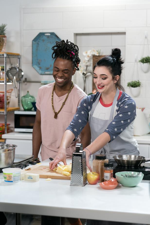 Host Lazarus Lynch with Contestant Irene Walton as she prepares her dish, Rustic Caramel Apple Pie, as seen on Chopped U, Season 1.