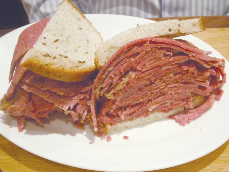 A stalwart of Baltimore’s Corned Beef Row since 1915, Attman’s lives up to its block’s name by serving a mean corned beef sandwich stuffed with meat fresh from steaming hot kettles. Corned beef isn’t the only sandwich this spot has on lock. The folks here stack slices of rye bread high with fillings like pastrami, smoked turkey and tender beef tongue to create sandwiches billed as “fit for a king or queen.” Don’t sleep on Attman’s Specialty Reuben, a hybrid that predates all the viral over-the-top sandwich fads. Opt for this fan favorite and your pick of corned beef, turkey or pastrami will come nestled inside two potato pancakes with coleslaw and pickle on the side.