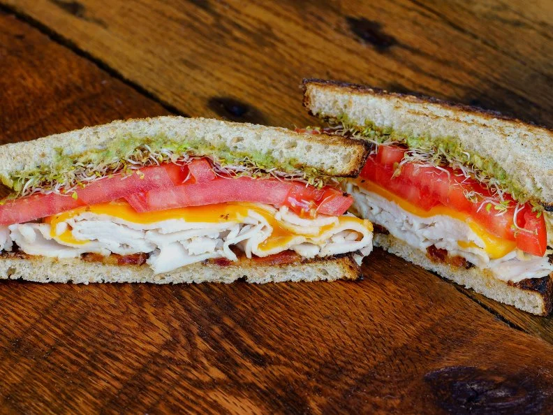 A consistent winner of “best of” accolades in the Nashville press, Mitchell’s Delicatessen is hailed for its superlative daytime fare. This shop’s focus is local, from smoking and curing its meats in-house to showcasing regionally sourced ingredients in its soups, self-serve salad bar, breakfast bar and prized sandwiches. Its temping roster of sandwich options include the Turkey Brie, the Banh Mi stuffed with roasted pork, the Smoked BBQ Beef Brisket and the French Dip, but the most-popular pick by far is the Turkey Avocado. This healthy(ish) sandwich brings juicy braised turkey and fresh avocado together with critically-acclaimed Benton’s bacon, cheddar, sprouts, tomato and mayo, all piled on slices of whole wheat bread from Tennessee bakery Silke’s Old World Breads.