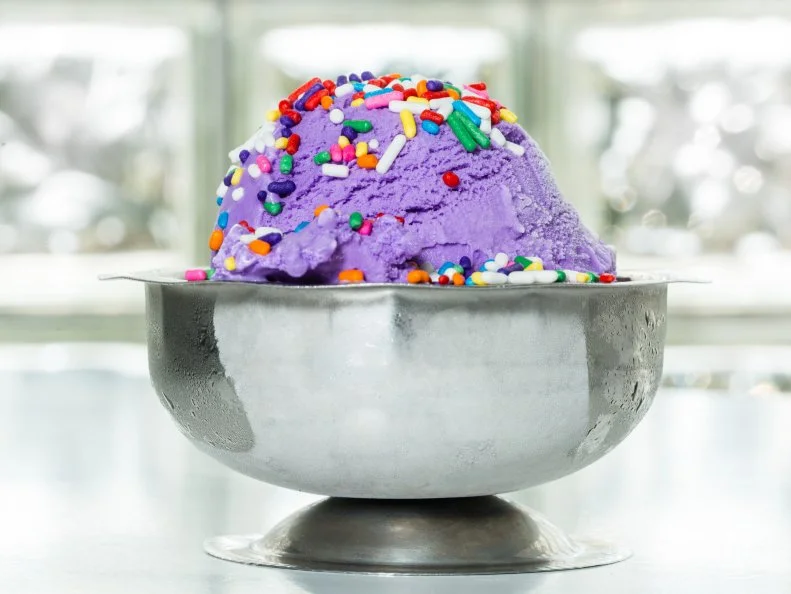 The Purple Cow is a â  50s-style diner slinging gourmet burgers and old-fashioned soda-fountain treats with a side of nostalgia and friendly service. The locally owned restaurant first opened in Little Rock in 1989, and now includes several locations across the state. Many are located near attractions like the Little Rock Zoo or Pinnacle Mountain, making a stop at The Purple Cow ideal on family outings. Bright purple and spotted dÃ©cor â   complete with the namesake mascot, Polly â   and seasonal activity sheets keep kids busy while they wait for Kidâ  s Fun Spot menu favorites like the signature Elvis Sandwich or corndog nuggets to arrive, rounded out with healthy sides like fresh fruit cups and applesauce. Cap off your meal with a round of milkshakes, like the signature Purple Vanilla for kids and the adult shake Apple Pie Lightning, made with Rocktown Distilleryâ  s Apple Pie Lighting moonshine and chunks of homemade apple pie.