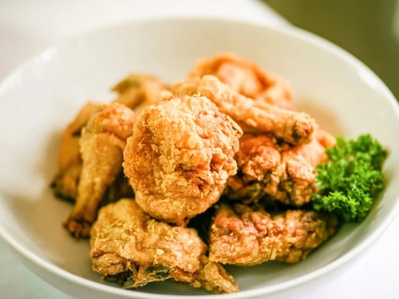 The origins of the Hoosier State’s nickname are murky at best, which explains why pan-fried chicken is a Hoosier tradition that just simply is. Get a taste at Hollyhock Hill, an Indianapolis institution that’s been around since 1928. They’re beloved for their family-style Indiana chicken dinner, starring skillet-fried chicken that follows a 90-year-old recipe: a mix of light and dark meat chicken are dredged in a proprietary tri-flour mix and fried in lard to exceptionally crunchy-juicy results. The spread is rounded out with classic sides like sweet corn, smoky green beans and mashed potatoes and pan gravy, and homemade biscuits and rolls with apple butter. The dinners are a hit with the whole family, but little ones who want their own dish can go for chicken tenders served with a side of homemade ranch dressing, and mac and cheese with a crust of crushed Goldfish crackers. Be sure to stop by Hollyhock Hill’s two wishing wells for a family photo opportunity and to toss in a coin and make a wish.