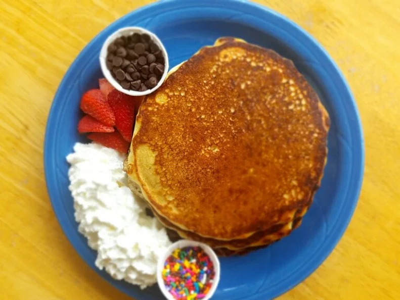 With its light-flooded glass-enclosed dining room and cherry blossom-lined patio, Doodles Breakfast & Lunch doesn’t look like it’s housed in a former gas station. For nearly a decade, Doodles has served Lexington locals and visitors "comfort food with a conscience,” emphasizing scratch-made and local ingredients. Factor in a stop at Doodles before a family outing to nearby Lexington Children’s Museum, Lexington Children's Theater, Rupp Arena or the Convention Center. For the kids, there’s the best-selling Johnny Cakes, Southern-style pancakes made with cornmeal and served with whipped cream, sprinkles and chocolate chips. There are also crowd-pleasing signature dishes like the Pigs and Puffs, featuring a duo of beignets and bacon topped with fruit and powdered sugar, and the KY Hot Brown Quesadilla, a riff on the state’s famous hot open-faced turkey sandwich that features a grilled whole wheat tortilla filled with local eggs, bacon, turkey, tomatoes and cheddar cheese.