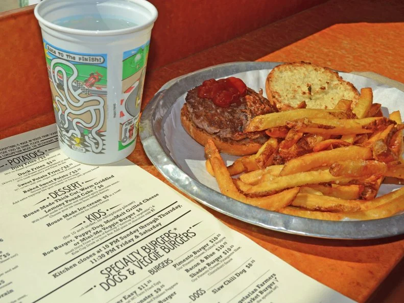 Bull City Burger and Brewery is not just another brewpub: Its commitment to quality food and brews shines in every element of the space. The food menu reflects the commitment to locally sourced ingredients for from-scratch dishes, including burgers crafted with pasture-raised, grass-fed North Carolina beef topped with housemade mayonnaise, pickles and buns. Kids can pass the time waiting for their food in the designated kids’ play area, outfitted with toys and coloring pages, where kids’ masterpieces are then put on display. Nosh on an order of the locally famous pickle chips, which are dredged in a pretzel crust and fried to order. The beer list reflects 60 different styles of beers, each named after a piece of Durham’s history. Try the flagship Parrish Street Pale Ale, an amber-hued, fruit-forward beer named for the brewery’s street address. There’s also a self-serve wine dispenser with red, white and rosé on tap. Weather permitting, take the party outside and soak up sun and suds on the garden-lined patio.