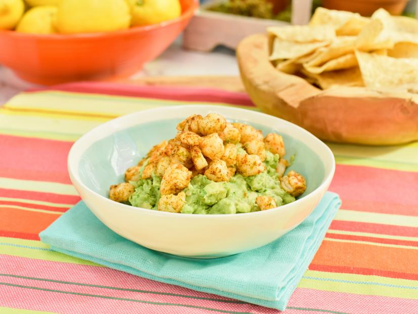 Jeff Mauro tops guacamole with Spicy Shrimp, as seen on The Kitchen, Season 17.