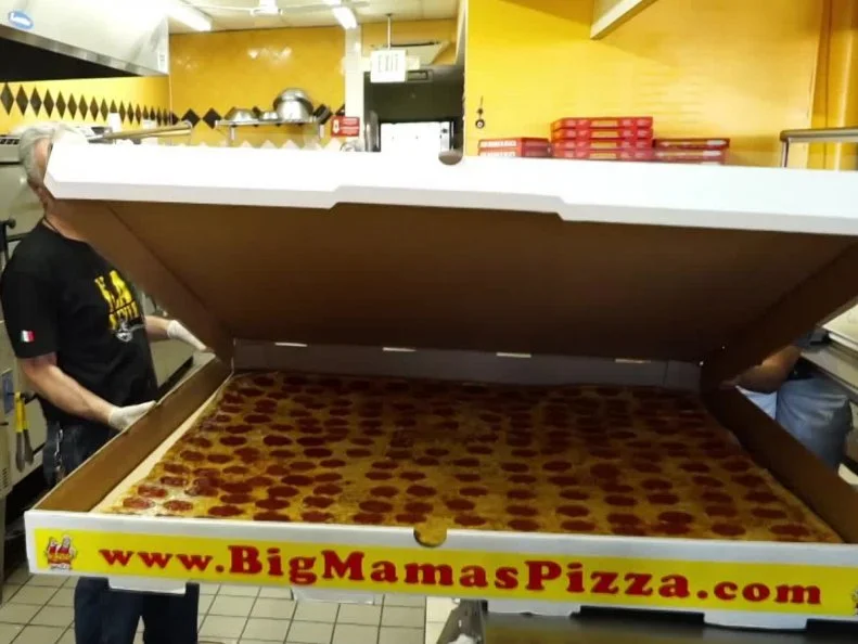 This L.A. institution more than lives up to the “big” in its name, with a pie so massive that it holds a Guinness World Record for the world’s largest delivery pizza. As if the Big Mama and Big Papa pies weren’t large enough — they measure 28 and 36 inches, respectively — the largest option clocks in at a whopping 54 inches. Each pie starts with 28 pounds of dough, and requires two people to make it. When it comes to delivery, a bike just won’t do for this behemoth. Instead, it’s transported by car in a special rooftop box designed to hold the supersized Sicilian.