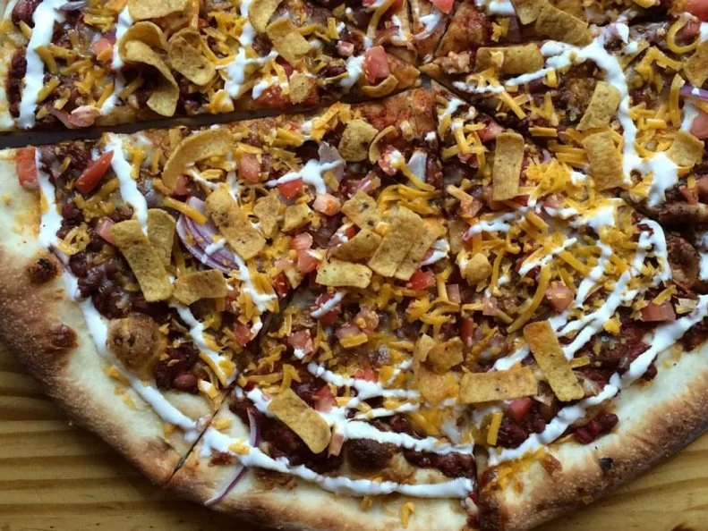 The list of specialty pizzas at Ian’s reads like the ultimate game-day party spread. Menu mainstays include Buffalo Chicken and Macho Nacho, but the real MVP only makes an appearance twice a year. It’s worth timing your visit to try this beloved option, the Chili Cheese Frito (available in October and February). The starring stew is ladled onto a sturdy pizza crust and finished with the typical chili toppings of cheddar cheese, red onions, sour cream and Fritos® corn chips. Can’t go wrong with that winning lineup.