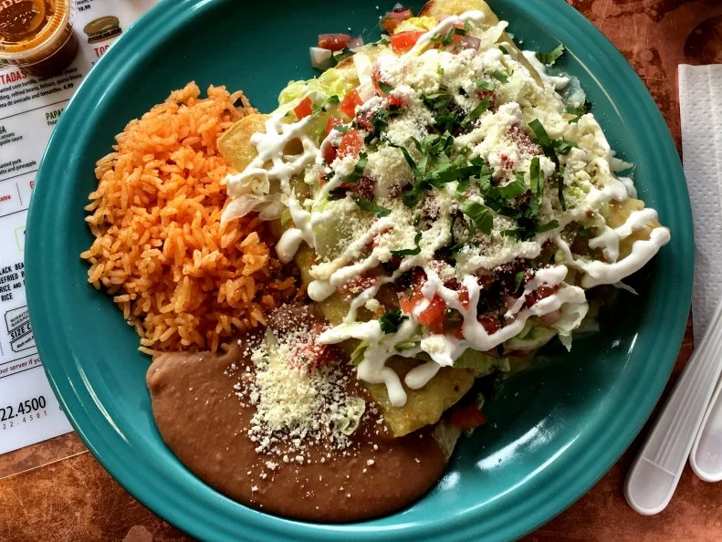 “Choose your canvas” reads the menu at Chilacates, a counter-service Mexican spot serving fully customizable tacos, quesadillas, burritos and more. Customers select from a choice of fillings, which include carnitas (pulled pork), chicken tinga (shredded chicken) and lengua (beef tongue), as well as sauces and sides. Upgrades, like seasonal grilled fish and carne asada (grilled steak), cost just a bit extra, as do add-ons like guacamole and sour cream, but it’s entirely possible to enjoy a filling meal for less than $10. For example, order a 10-inch burrito with pork en chile verde ($5.99), add cheese ($.70), pair it with a Mexican soda ($2.50) and the bill comes to just $9.19. Shell out a couple more bucks for an even more substantial meal: the enchilada plate. Priced at $10.99, it comes with fresh corn tortillas, your choice of filling, salsa verde and melted cheese, along with a side of rice and refried beans. Jamaica Plain is the home to the only two Chilacates in Boston, but crowds from other parts of the city make the pilgrimage when they’re craving Mexican classics on the cheap.