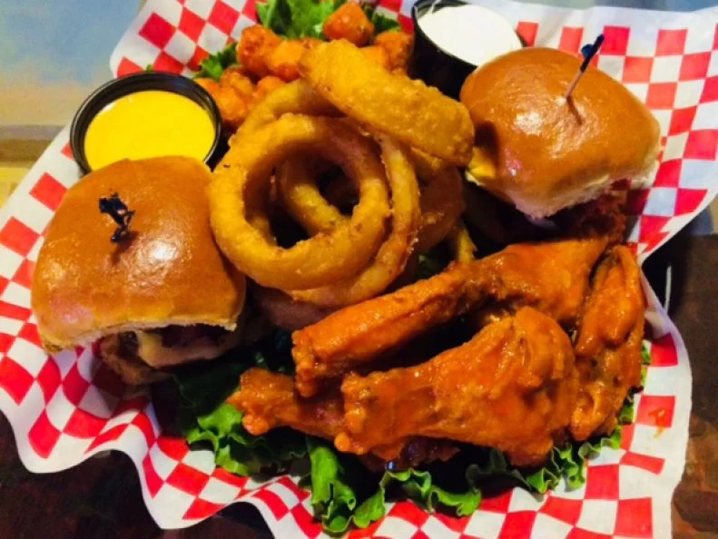 A mainstay in the Back Bay since 1986, the Pour House almost always feels like a party, with a packed bar, loud music and cheap, cheap bites perfect for a crowd. A popular pick is the All-Star Platter heaped with a stack of beer-battered onion rings flanked by two bacon cheeseburger dippers, sweet potato tots and buffalo wings, all for $10.95. There are plenty of other classic bar foods, too, such as nachos and chicken fingers, which are all in the $7-and-under range. And don’t sleep on the all-day breakfast menu stuffed with omelets, waffles and more. Most of these morning-centric dishes clock in at less than $10.
