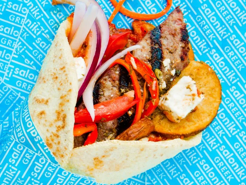 Go Greek at this fast-casual eatery in Fenway. Billed as a “tribute to the humble Greek sandwich shop,” this counter-service spot has some heavyweight culinary talent behind it. Co-owners Jonathan Mendez and Eric Papachristos joined forces with James Beard Award-winning chef Jody Adams to open Saloniki Greek. She dreamed up many of the items on the menu, including The Jimmy. Shell out $9 for this option and you’ll be rewarded with a freshly made pita brimming with local loukaniko pork sausage, grilled red pepper-sesame sauce, shaved mizithra cheese, housemade sriracha, greens, local tomato, onion, Greek fries, spicy slaw and herbs. Pair it with a frappe and you’ll still ring up at less than $13.