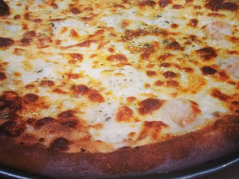 Everyone has a favorite pizza joint in Boston. But Santarpio's in East Boston tops a lot of lists. Both the pizza and the prices are old-school at this beloved Boston institution, which first opened as a bakery in 1903. Pizza was added to the menu 30 years later, and countless number of pies have been served in the decades since. An Italian Cheese Pizza clocks in at just $9.50. Shell out a few extra bucks for a topping-strewn pie like the Italian Cheese, Sausage and Garlic Pizza priced at $13. Even a glass of house wine, at $3.50, is a bargain. If you dine at the original location, make sure to bring cash. If you head to the Peabody branch, you can pay with a card.