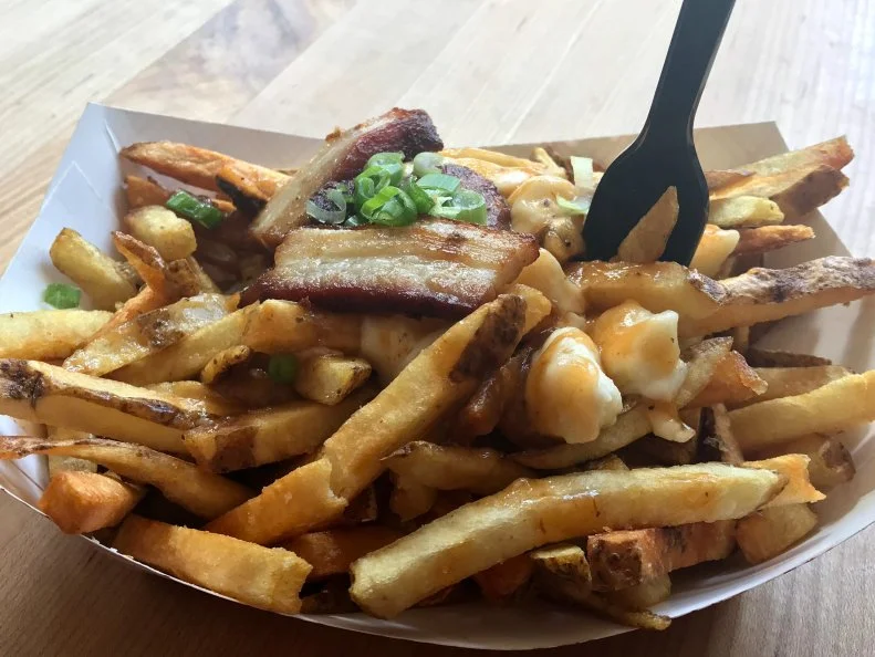 Getting fries drenched in gravy just seems like the right thing to do at a restaurant inspired by sauces. Locals pack in to do just that at Saus, which serves a version of poutine that's addictively delicious. Priced at $6.75, this dish features a heap of golden fries topped with cheese curds and smothered in that housemade gravy. For a couple bucks extra per topping, you can further adorn your fries with pork belly, kimchi, bacon bits and more. Another popular item is the Frik, a hand-rolled beef and pork sausage on a bun, which costs $8.50 and can also be customized with a variety of toppings.