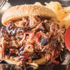You’ll find award-winning Southern-style barbecue at Squealers’ three locations in central Indiana. The pitmasters here invest serious time in their work, smoking the meats for 14 hours over a blend of cherry and hickory woods. The labor-intensive brisket is rubbed 24 hours before going on the smoker and sprayed every 45 minutes with apple juice, then cooked at 180 degrees and wrapped to finish at 202 degrees. Among the other fan favorites are the Barbeque Nachos and Jan's Spud (named after the founder’s mother), which is an extra-large loaded baked potato stuffed with pulled pork or chicken or smoked turkey.