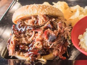 You’ll find award-winning Southern-style barbecue at Squealers’ three locations in central Indiana. The pitmasters here invest serious time in their work, smoking the meats for 14 hours over a blend of cherry and hickory woods. The labor-intensive brisket is rubbed 24 hours before going on the smoker and sprayed every 45 minutes with apple juice, then cooked at 180 degrees and wrapped to finish at 202 degrees. Among the other fan favorites are the Barbeque Nachos and Jan's Spud (named after the founder’s mother), which is an extra-large loaded baked potato stuffed with pulled pork or chicken or smoked turkey.