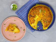 This pancake uses the technique for making traditional Persian tahdig, or "scorched rice" to create a golden rice pancake. Food Network Kitchen filled the center with running egg yolks that mingle with the rice to form a crispy self-saucing pancake perfect for serving with hearty stews or enjoying on its own.