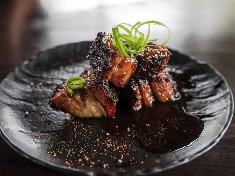Ronnie Killen brings equal parts steak and ‘cue to his only concept within Houston city limits — you’ll have to schlep down to Pearland to visit the others. At STQ, you can choose your own adventure by starting off with the perfectly sweet and savory pecan-smoked pork belly topped with cherry-habanero barbecue sauce as a starter, then move on to a just-how-you-like-it filet with Killen’s famous creamed corn or gouda mac ‘n’ cheese sides. Regardless of whether you ST or Q, save room for dessert — you’ll find a helping of meat in the bacon tres leches bread pudding, and it’s worth every last bite.
www.killensstq.com
