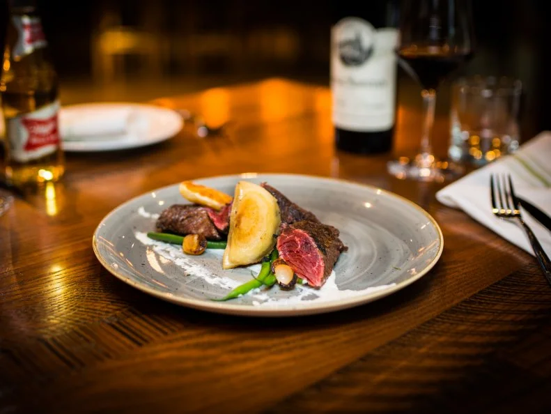 The hottest new restaurant that Montrose never knew it needed, Riel operates under Executive Chef Ryan Lachaine who incorporates his Ukrainian heritage and hometown influences from Winnipeg, Manitoba, into an inspired menu, which is valiant but approachable. Lachaine adds a pierogi alongside the hanger steak, but you can also order them a la carte — and you should. The artfully plated duck breast is splashed with bright yellow corn purée and gently laid atop crispy green shreds of snow peas and turnip, allowing for the perfect mouthful in each bite.
www.rielhtx.com