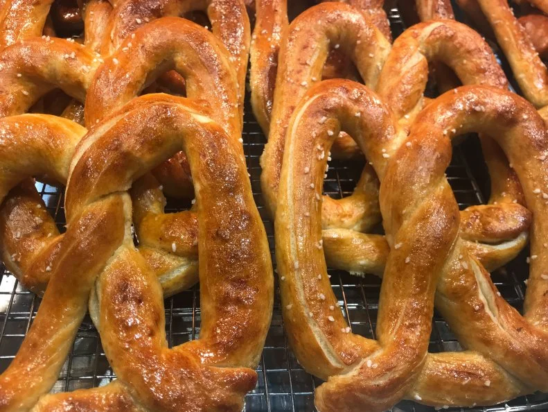 The bewitching scent of buttery baked dough draws customers to this tiny stand tucked away in Reading Terminal Market. Follow your nose to Miller’s Twist and you’ll find traditional soft pretzels priced at $2 each, as well as sausages and hot dogs wrapped in butter-lacquered dough. Options include an all-beef jumbo frank ($3.50, two for $6), a smoked cheddar-turkey sausage ($3.75, two for $6.50) and a jalapeno-cheddar dog ($3.25, two for $5.50). The meat is about as local as it gets, sourced from right next door at the L. Halteman Family Country Foods butcher stand. 