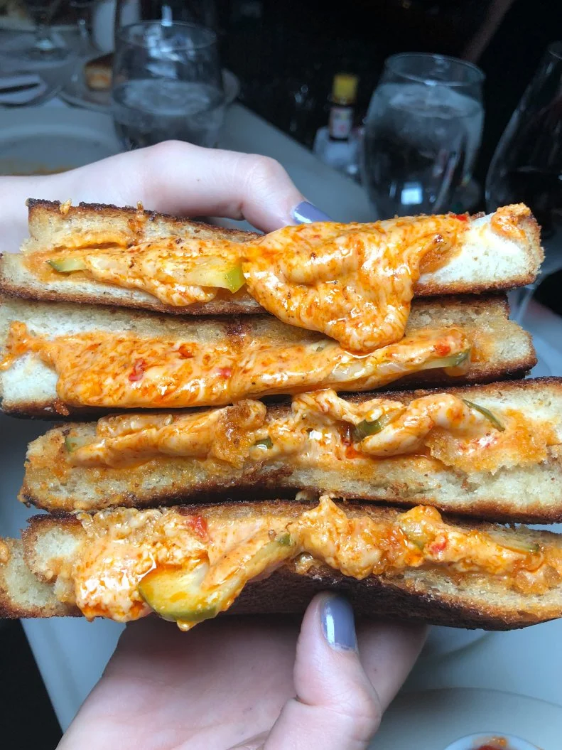 Happy hour at this spiffed-out spot on South Street draws the crowds with more than just the drink specials served from 5 to 7 p.m. nightly. Trust us, a trip to Rex is worth it for the $5 pimento grilled cheese alone. Executive Chef Justin Swain delivers a Southern-inflected take on the traditional grilled sandwich by melting his own pimento cheese with pickles between two thick slices of Texas toast. It all adds up to an unapologetically gooey sandwich perfectly accented with bright Southern flavor. 