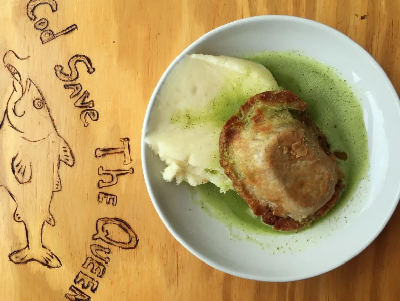Sam Jacobson introduced proper UK flavor to South Philly with Stargazy, a pie-and-mash purveyor modeled after the traditional shops of his native London. In his tiny storefront along East Passyunk Avenue, the chef turns out savory pies in playful variations like broccoli-cheddar, buffalo chicken and pork mole. He keeps it fresh by switching up the options regularly, but there’s one mainstay that never comes off the menu. The Traditional comes stuffed with not much more than ground beef and onions slow-cooked Jacobson’s way (red wine and Worcestershire, among other touches). A single Trad, along with a helping of mashed potatoes and a pour of pleasingly green parsley “liquor,” rings up at $9.
