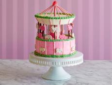 What's adorably sweet and goes around-and-around? This pastel carousel cake uses animal crackers and Japanese-style biscuit sticks as clever decorations. The base is box mix cake and pudding.