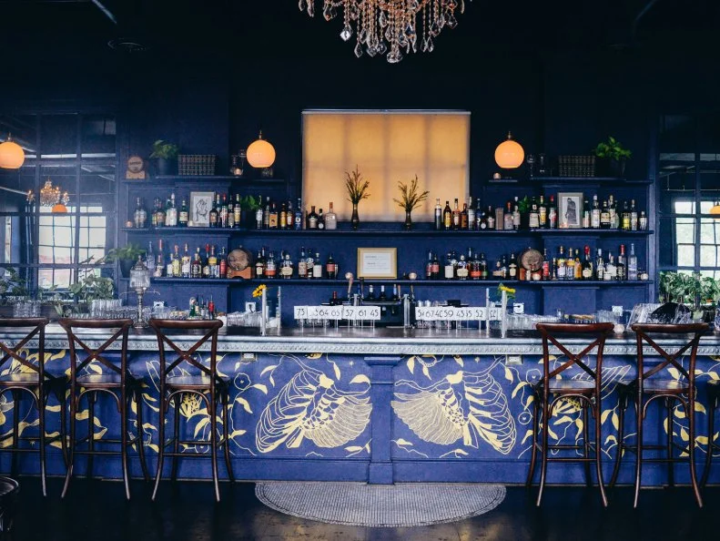 Situated above the Belgian beer hall De Kleine Duivel, the polished, airy Bluebird cuts a sophisticated silhouette over Hampden. A real-deal cocktail-drinkerâ  s bar with an erudite literary bent â   itâ  s named after a bit of Charles Bukowski verse â   the bar changes its menu by the season, employing all the bells and whistles that turn good drinks into great ones. (One shockingly clear hand-carved ice hunk for my Vieux CarrÃ©, if you please). To poorly paraphrase the poet: If there is a thirsty bluebird in your heart that wants to get out, go ahead and pour a little whiskey on him.