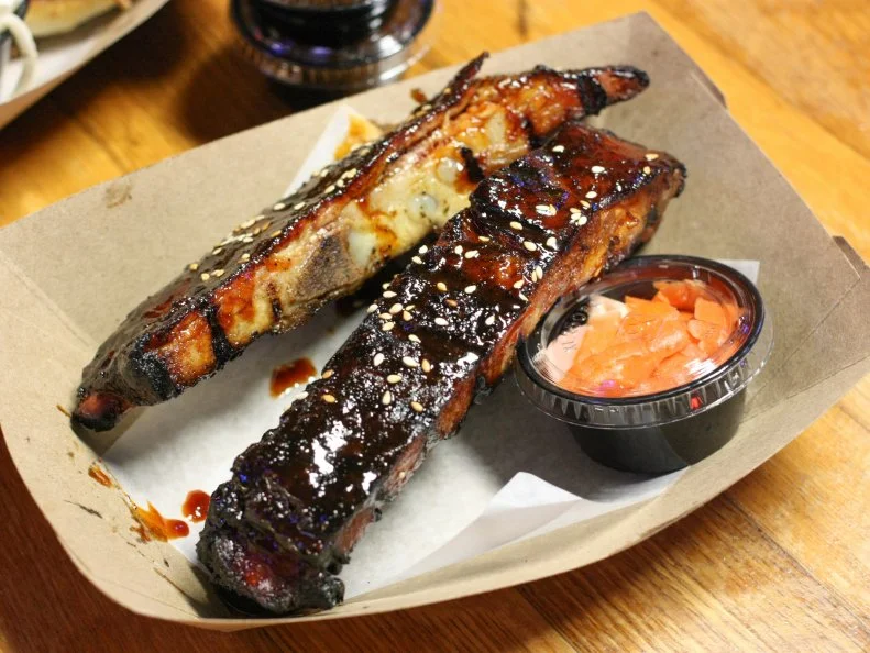 You’ll smell Josh White before you see him. Slinging out of a humble stall in soon-to-be-revamped Cross Street Market, the outgoing pitmaster is the meat man behind Smoke, which has grown into the city from its original outpost due north, in Cockeysville. If you see the sesame-studded Korean sticky ribs, get them before they sell out, but know that permanent menu items, like the Notorious P.I.G. (a Carolina-style pulled pork sandwich), won’t steer you wrong.