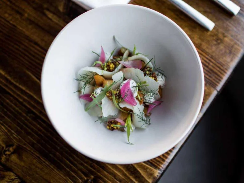 The food and cocktails at this Midtown spot take creative liberty with classic favorites. Start with mixologist Will Leeâ  s take on a gin martini, dubbed the Heroic Intention, adding caper-infused Dolin dry, sesame oil and black pepper to add a bit of pop to the classic cocktail. Oysters are served Chicago-style â   with the accoutrements of a classic Chicago hot dog â   to pay homage to chefs John Vermiglio and Joe Giacominoâ  s former stomping grounds. Work your way through the playful menu digging into a smoked whitefish dip topped with everything seasoning and follow up with the loaded baked potato pierogis oozing with aged gouda, topped with green onion and sour cream.