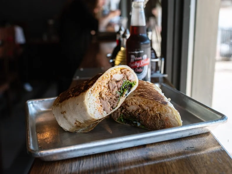 Sample some of the most-popular specialties at this Filipino spot in one portable dish that comes all wrapped up in dough. The 800 Pound Gorilla combines Guerrilla’s famous chicken adobo and slow roasted pork — along with sriracha, hoisin, fried garlic, a paprika-laced cream, a sous vide egg and more — in a burrito so big it requires two tortillas. At $12, this two-handed beast might not be the cheapest of cheap eats, but it’s large enough to feed at least two people. Still not big enough? Ask for the Silverback: it’s double the size.