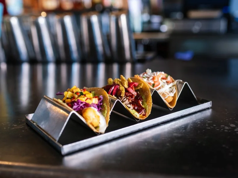 Mission Taco Joint pays homage to Mexican street food with its lineup of Baja-inspired bites that can be had for a bargain. Their solid taco selection continues to reign supreme on the local scene, but one option has remained the king since the start — the BBQ duck ($4). Slow-roasted duck and pork belly carnitas are piled into tortillas, then festooned with pickled onions, crispy jalapeno strips and an ancho-agave glaze that’s both smoky and sweet. Go for the late night happy hour at any one of their locales and the tacos drop to $2 a pop.  