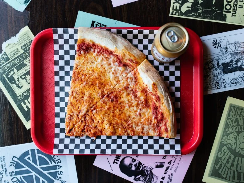 Sometimes (okay, all the time) we just want to cap the day off with two huge slices of pizza and a beer for cheap. This daydream becomes a reality at Pizza Head, which offers a $7.95 special that includes two cheese slices and a brew. Located in the eclectic South Grand neighborhood, this unique spot brings together Chef/Owner Scott Sandler’s love for punk rock, New York-style slices and vegetarian cuisine. Black walls are spattered with neon pink paint. The jukebox blares The Ramones. And the pizza options cater to both vegetarians and vegans (hello, cashew cheese!). Welcome to Pizza Head.