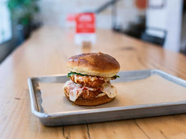 Porano Pasta might be known for its build-your-own pasta and salads, but its sleeper hit is the chicken parm sandwich. For $9, you get a chicken thigh that has been marinated, pounded thin, and fried until crunchy (but still juicy), then placed on a freshly baked brioche roll with pomodoro sauce, mozzarella and fresh basil. Word of warning: this sandwich might give your salad-eating companions a serious case of food envy.