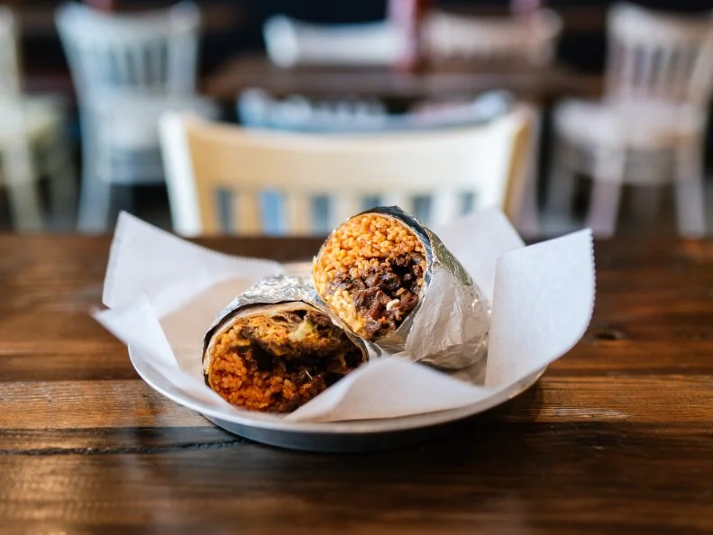 What started as a food truck slinging Korean-accented tacos and burritos has grown into a mini restaurant empire that stretches across two states. Demand shows no signs of slowing, with fans packing in for Seoul Taco’s fusion food. The best part? It’s budget-friendly. Case in point: $8 gets you a gigantic burrito loaded with kimchi fried rice, lettuce, cheese, carrots, green onions, sour cream, your choice of meat (get the bulgogi steak) and the spot’s signature sauces.