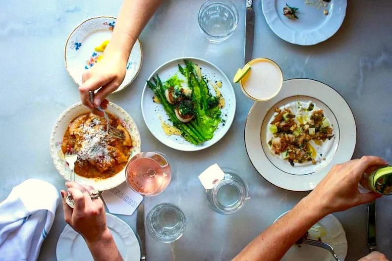 When diners sit down at Kindred, 30 miles north of Charlotte in the tiny town of Davidson, servers immediately bring to the table a freshly baked pouf of Kindredâ  s now-famous â  milk breadâ   and cultured butter. That simple gesture sets the stage for a meal so thoughtful and memorable that it has earned Chef-Owner Joe Kindred several nominations for a James Beard Award. Small, beautiful plates mean tablemates can share from a changing array of seasonal dishes along with mainstay favorites. Squid ink conchiglie pasta, with North Carolina-caught shrimp and sea urchin butter, consistently earns raves. Duck-fat potatoes with garlicky aioli are satisfyingly crisp. Even humble broccoli smartens up when dressed with peppery romesco sauce, a fried egg and Manchego cheese. The same imaginative spark infuses the cocktail menu, but the wisest decision is to simply select â  Barkeepâ  s Choice.â   Finish with cinnamon ice cream and butterscotch cookies.