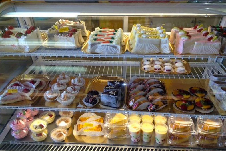 Rustic breads, sweet and savory empanadas, and lavish desserts await behind this unassuming storefront on Central Avenue, the cityâ  s global-cuisine corridor. Grab a tray and some tongs, and help yourself from the wall-high cases containing conchas, bolillos and other baked goods. The Mexican bakeryâ  s founders, Zhenia Martinez and Manolo Betancur, are best-known for their iconic tres leches cakes. Impossibly rich and layered with strawberry, pineapple or other fruit fillings, these creamy creations appear not only at traditional quinceanera birthday parties, but also at an increasing number of weddings and other celebrations across the city.