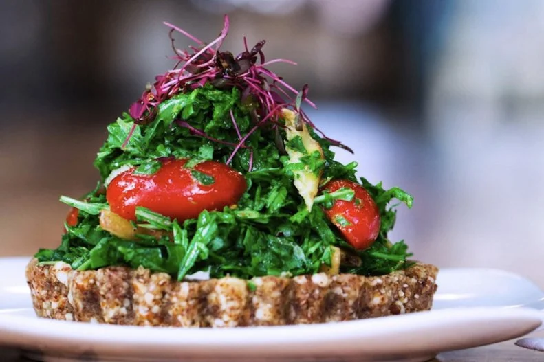 Skeptics quickly become converts to the vegan cuisine served at Lunaâ  s original location in the booming South End corridor and at the newly opened suburban Southpark restaurant. Organic- and raw-food fans belly up to the (juice) bar for one of several dozen smoothies and cold-pressed juice blends. The signature Fire and Brimstone Burger is a blended-grain patty loaded with hummus, guacamole, onions and tomatoes; it packs heat in the form of Lunaâ  s housemade hot sauce. BBQ Sliders begin as a bed of roasted mushrooms steeped in a tangy sauce. Theyâ  re topped with a jalapeno-spiced coleslaw and served on crusty sandwich buns. Lunaâ  s Turtle Cake â   a rich chocolate, caramel and nut confection â   was recently named one the 50 Best Vegan Desserts in the U.S. Itâ  s sure to win over the doubters, if any remain after a meal here.