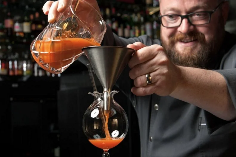 Playful spirits abound at the clubby Punch Room, where master mixologist Bob Peters developed a menu of imaginative cocktails. Some have fanciful names such as a tequila-mead-peach concoction called I Donâ  t Want You, I Mead You. Cardinal Gin and Cheerwine soda, combined with vermouth and lemon, are saluted in the Ode to North Carolina. Alcohol abstainers arenâ  t forgotten here: Beet the Odds is a lemony ginger-beet blend. But the namesake punches, prepared in batches for two, four or six guests, are standouts all on their own, especially the hyperlocal ALL-CLT Punch. Itâ  s crafted with Charlotte-made Doc Porterâ  s gin and Lenny Boy kombucha, then enhanced with lavender-basil syrup and fresh-pressed lemon.